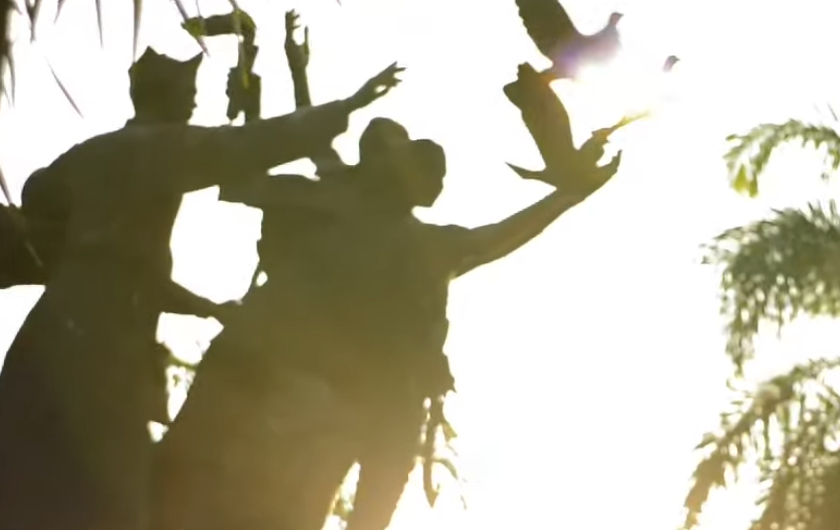 Dancers silhouetted against the sunlight